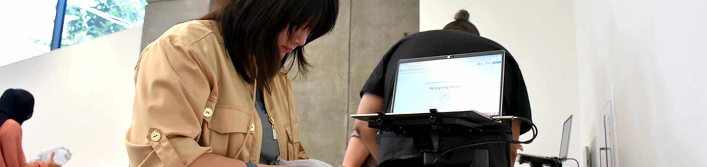 student with an infant simulator
