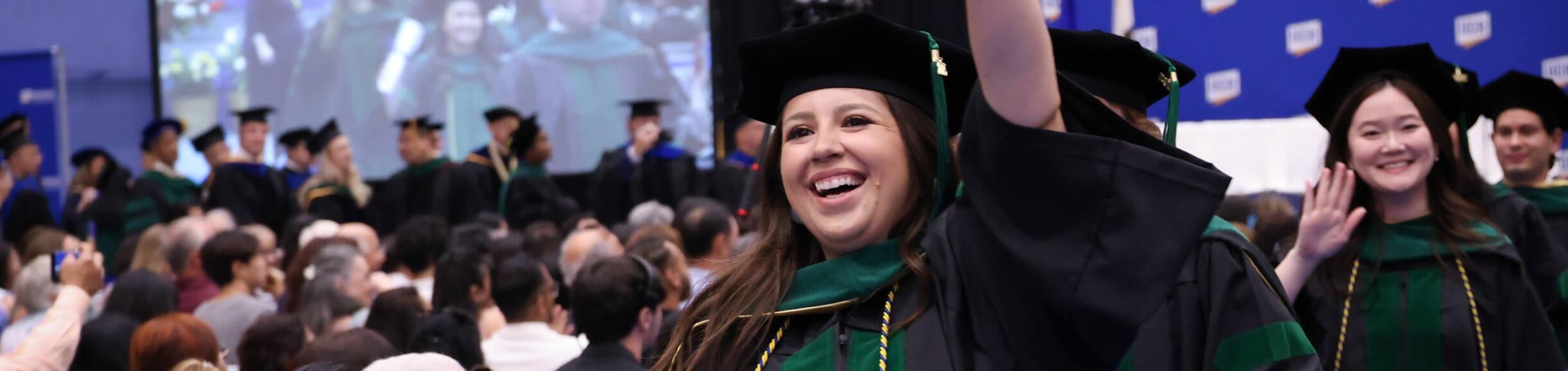 member of the class of 2025 waving