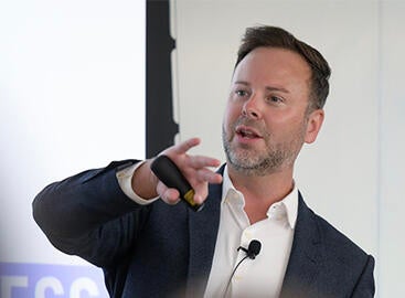 Prof. Kyle Ingram teaching an undergraduate business class