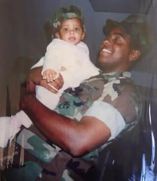 U.S. Marine Michael McCollum Sr. with daughter Aaliyah McCollum.