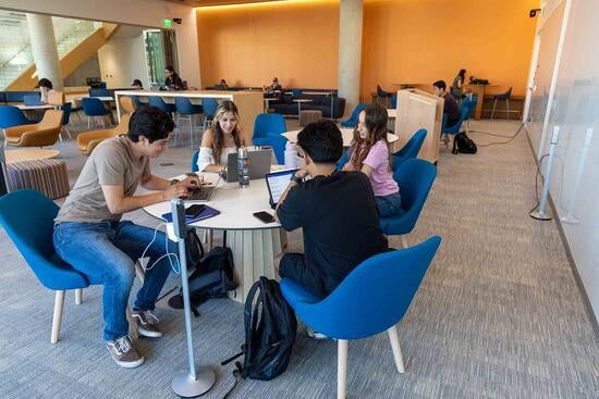 Students studying in New Business Building Lobby