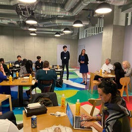 Fellows discussing in colorful room