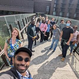 Fellows smiling while touring OIST campus