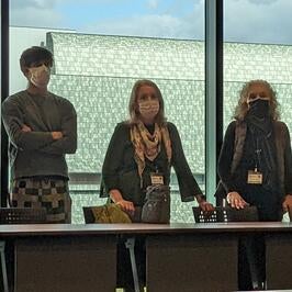 Leadership and fellow planning out room arrangement