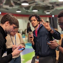 Fellow making peace sign at awards ceremony