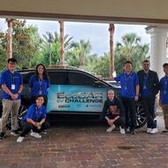 students standing in front of cadillac lyriq