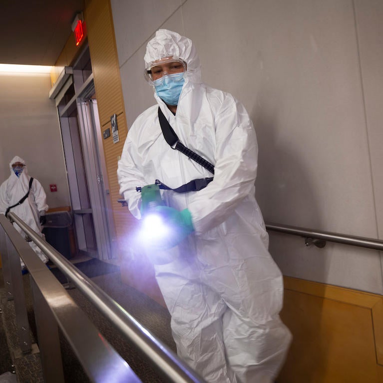 Robert Felder, with Facilities Services tries out an electrostatic sprayer on a railing during a training exercise on Wednesday, March 3, 2021, at UC Riverside. (UCR/Stan Lim)