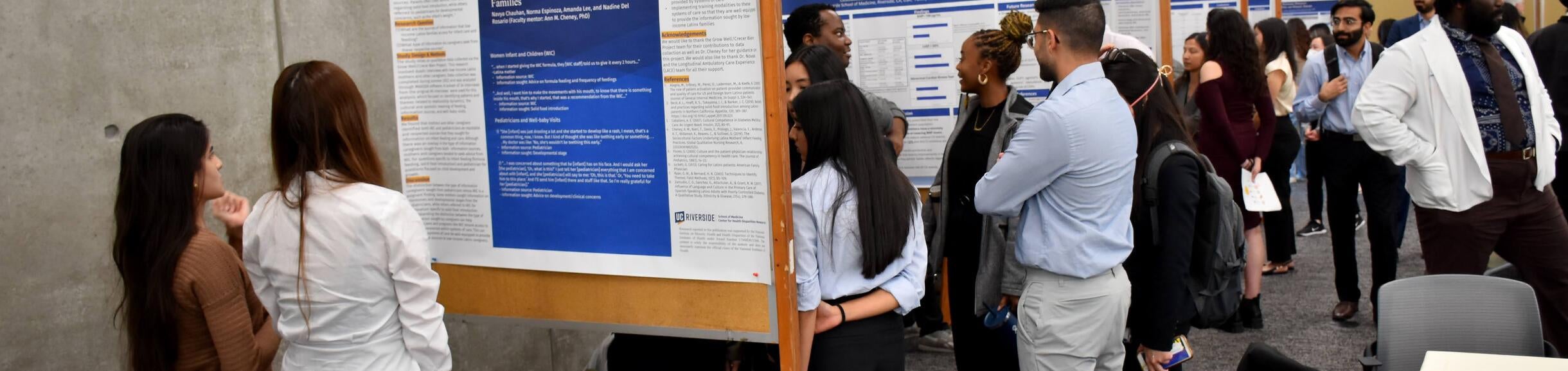 Students Presenting Poster Deans Research Day 2024