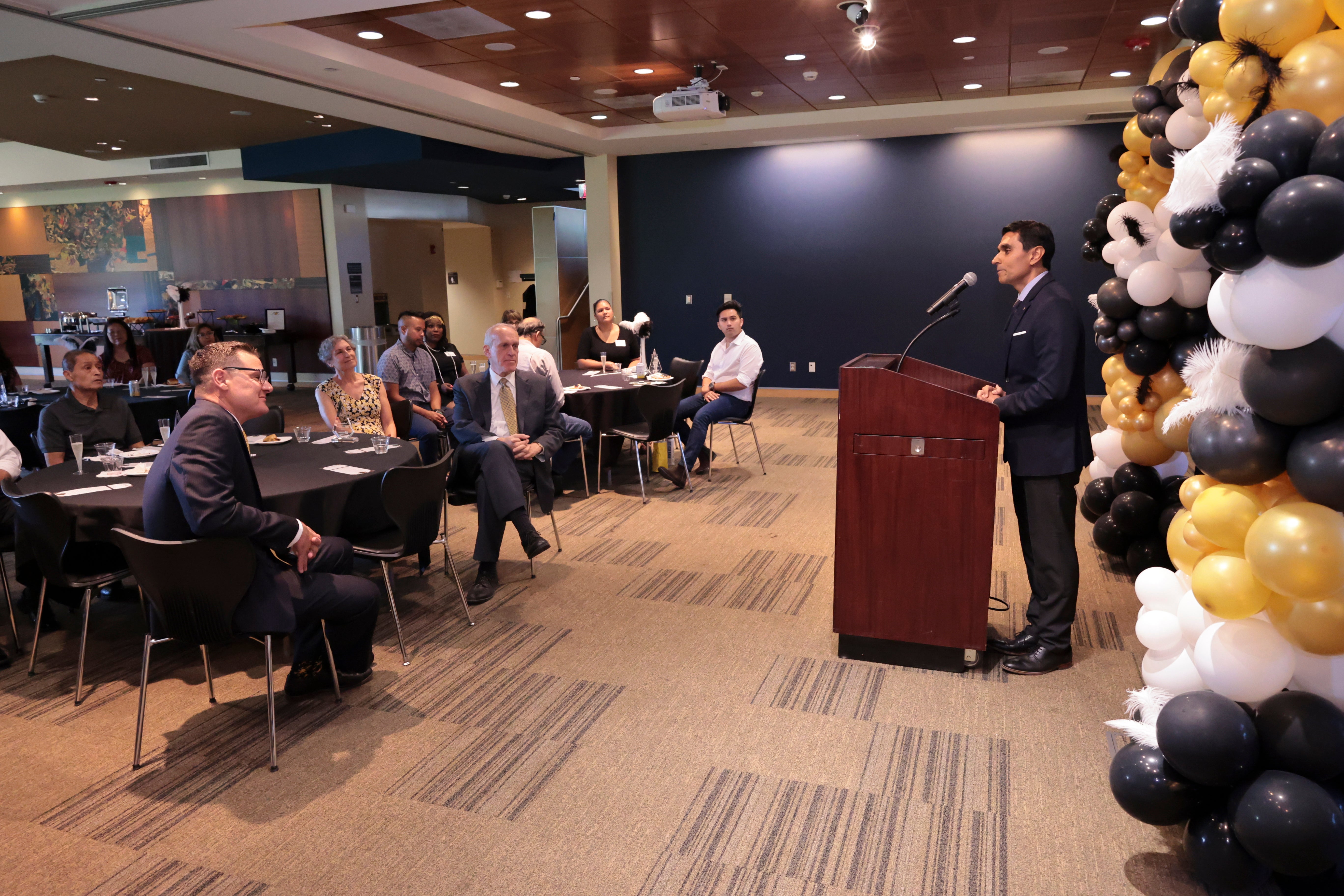 Incoming '22-'23 Staff Assembly President Agam Patel recognizes the '21-'22 President Jeff Girod at the 2022 Outstanding Staff Awards