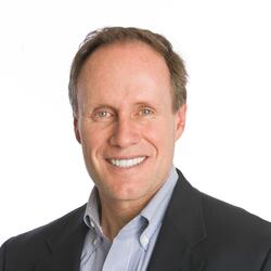 Stephen M.R. Covey headshot, a man in a suit