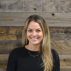 Lauren Copeland, Senior Customer Success Manager at LinkedIn, wearing a black sweater, smiling for headshot