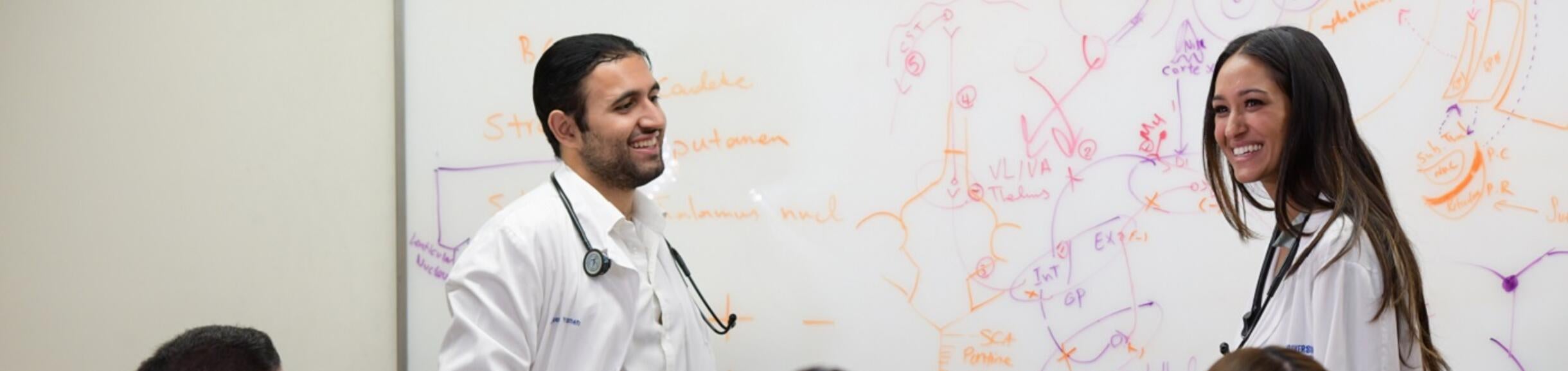 students at a white board