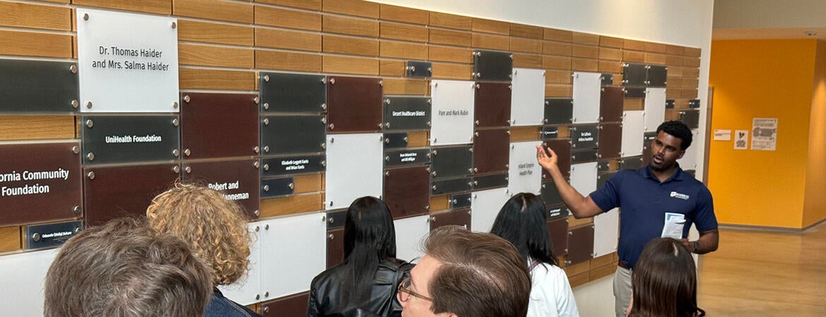 Vladimir Oge leads tour of guests at the SOM Ed II building