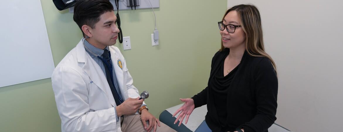 Resident speaking to a patient