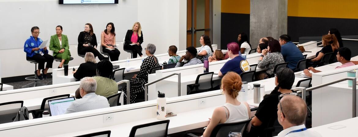 Audience watching the panelists at the WIMS 2025 event