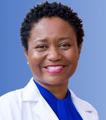 Adwoa Osei in front of the SOM Ed 2 building