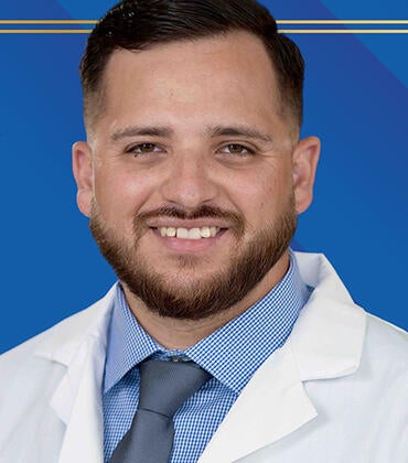 Paul Patlan in front of background