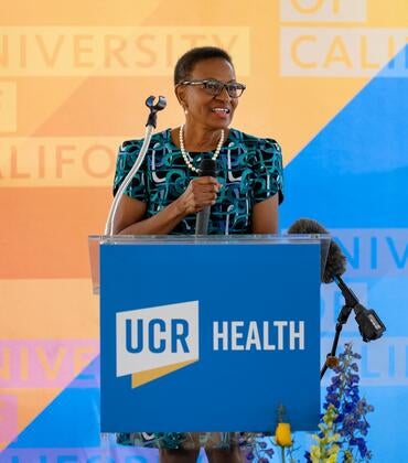 VC and Dean Deborah Deas speaking in front of a crowd