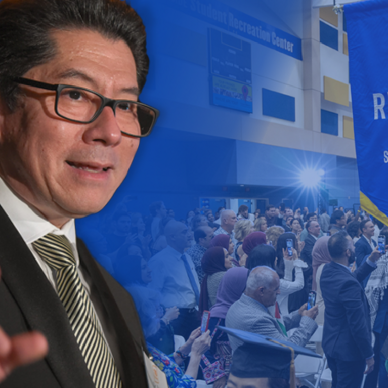 Deborah Deas and Pablo Joo in front of commencement