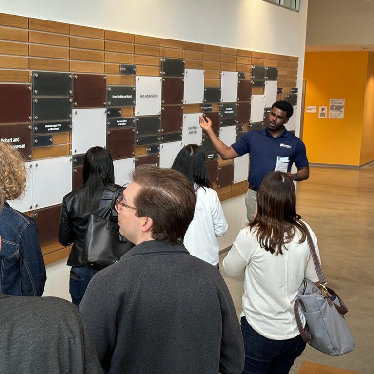 Vladimir Oge leads tour of guests at the SOM Ed II building