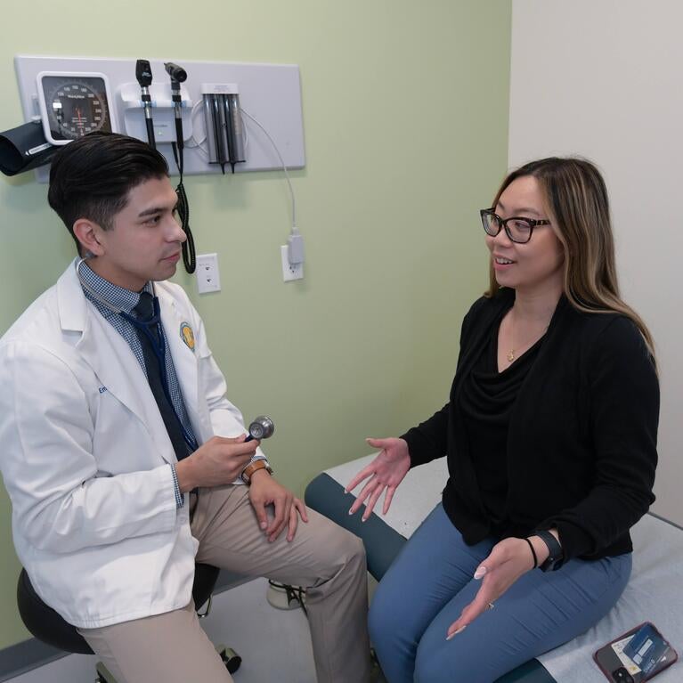 Resident speaking to a patient
