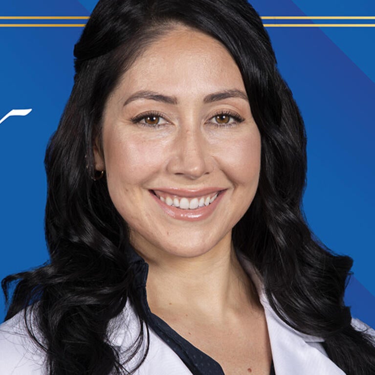 Jennifer Pinal in front of background