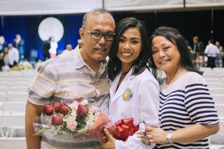 Maria Guerrero with her parents at the 2018 White Coat Ceremony