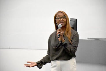 Michelle Burroughs with microphone