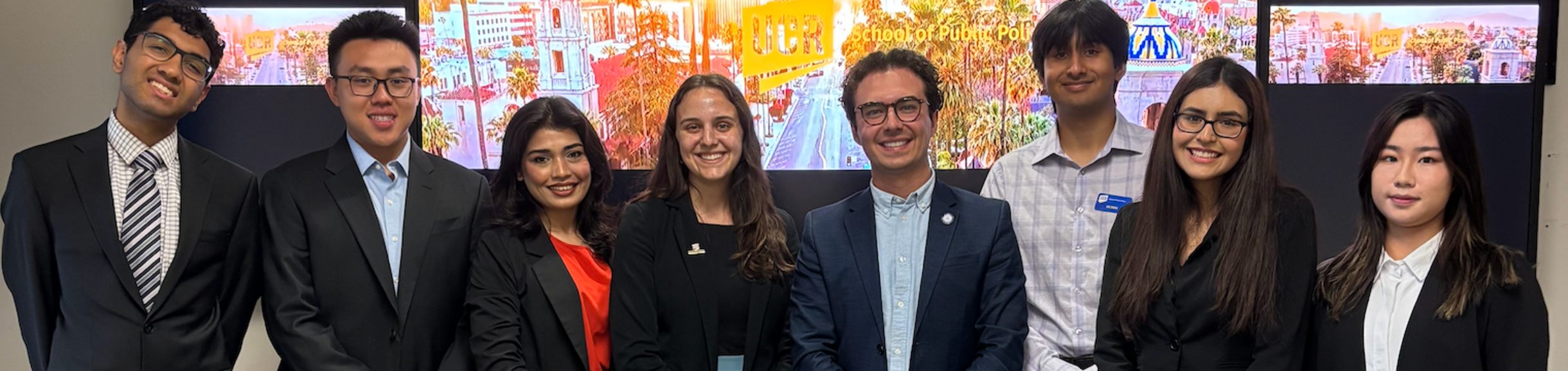 Group photo of students and Philip Falcone