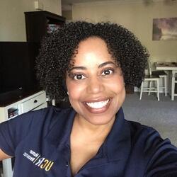 Seana Nunez, Senior Employee & Organizational Development Consultant at UC Riverside, wearing a navy blue UCR Human Resources branded polo shirt smiling