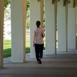 woman walking Rivera Arcades (c) UCR/Stan Lim