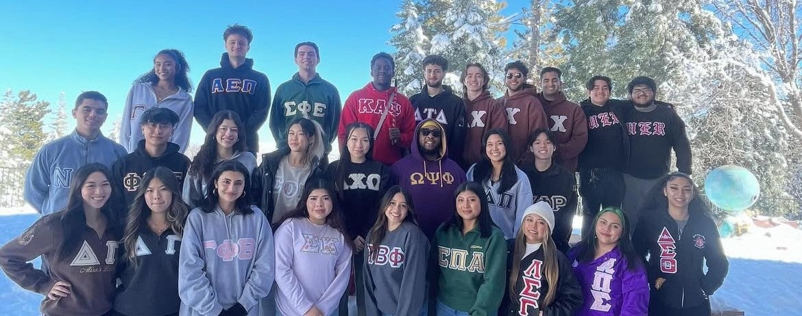 Leadership Retreat attendees with their chapter letters on their jackets