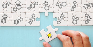 A decorative image of the final piece being added to a puzzle.