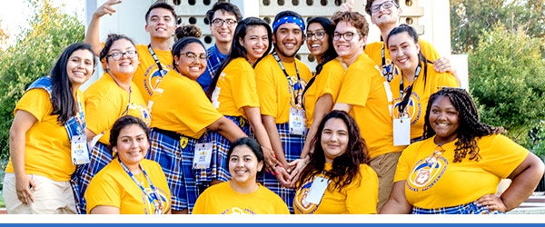 Highlander Orientation leaders pose in their Tartan gear in front of the UCR Bell Tower.