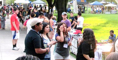Representatives from student organizations greet students at the annual Involvement Fair.