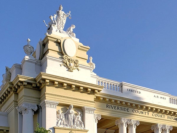 A distressed student sits in contemplation.