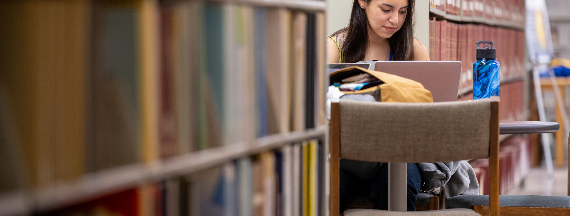 Student reading at Rivera library