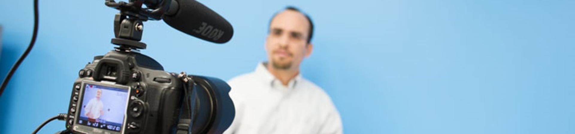 camera filming man