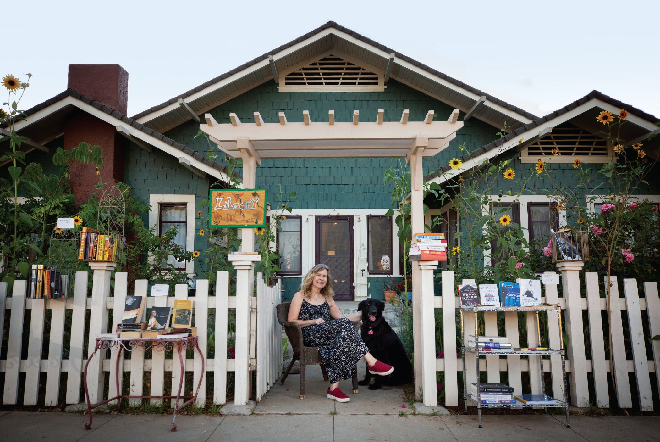 Susan Straight sitting in front of her home