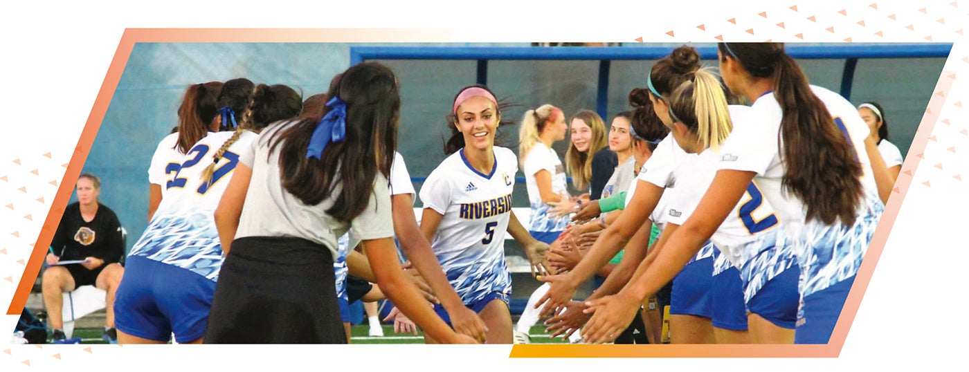 Alyssa Carranza entering the basketball court at the University of California, Riverside
