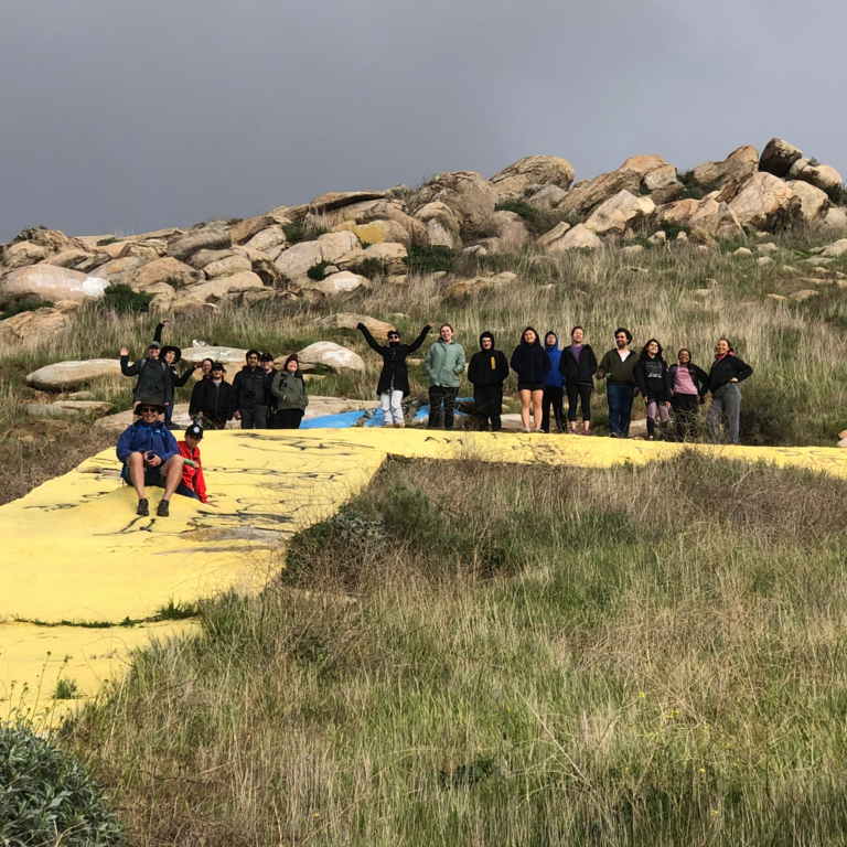 People sitting on a hill 