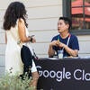 Attendee visiting the Google Cloud and Carahsoft sponsor booth.