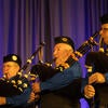 UC Riverside Pipe Band performing on stage.