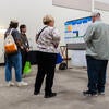 Attendees viewing posters at the poster showcase.