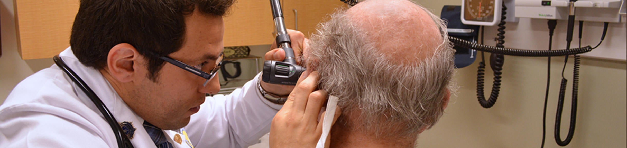 Student examining patient