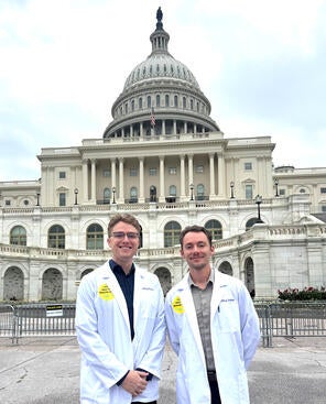 Nathan Everhart and Zachary Daniels in front of the US Capitol on SNaHP advocacy day