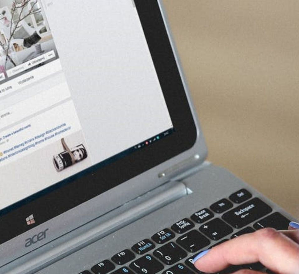 Person typing on a laptop as they work on digital marketing