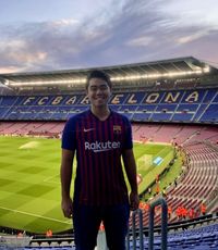 UCR University Extension student Leo Tomaya standing in the Barcelona futbol stadium