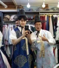 Two guys in a clothing shop taking a selfie