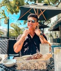 UCR University Extension alum Linkai Han outside dining